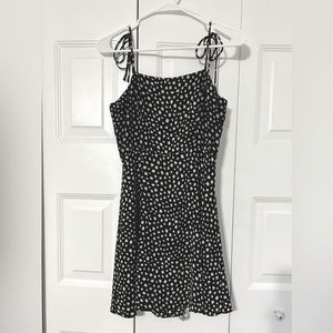 Mini black and white dotted sun dress with bows on straps!